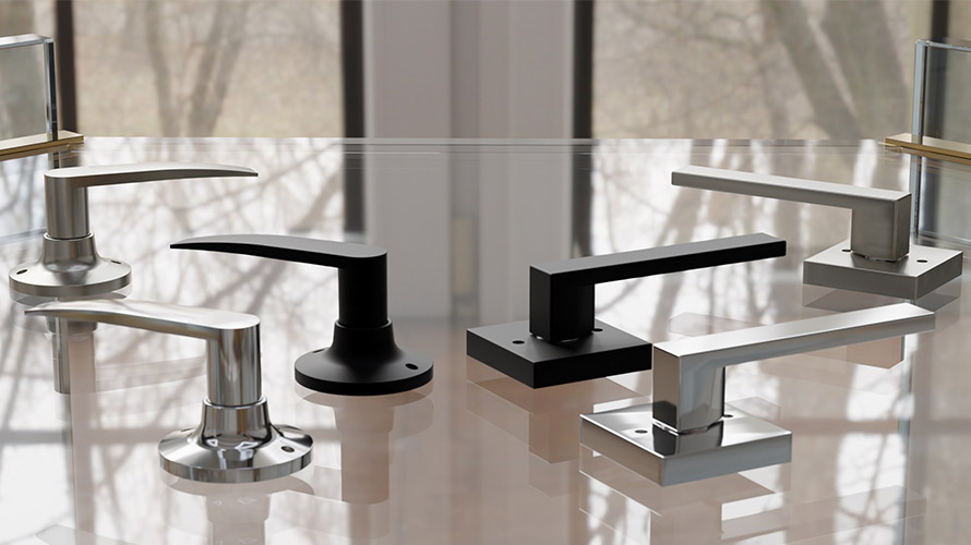 black and silver door levers on glass table